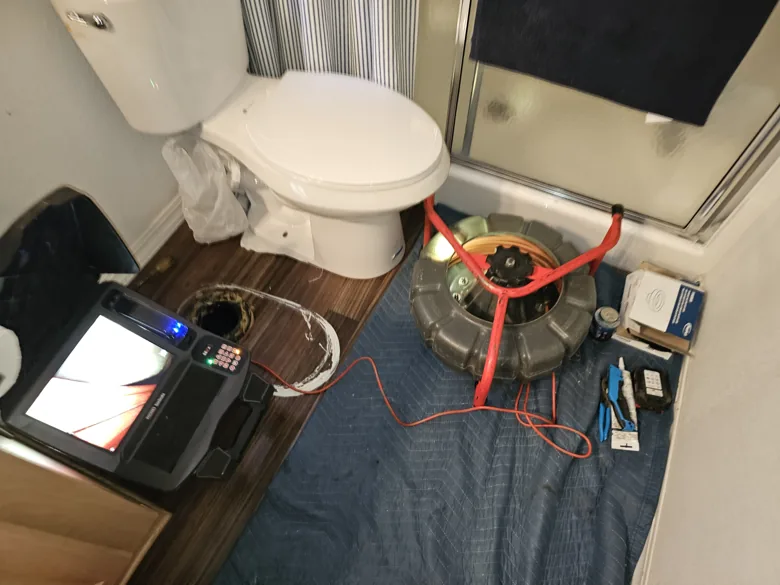 Inspection monitor and cable reel beside toilet