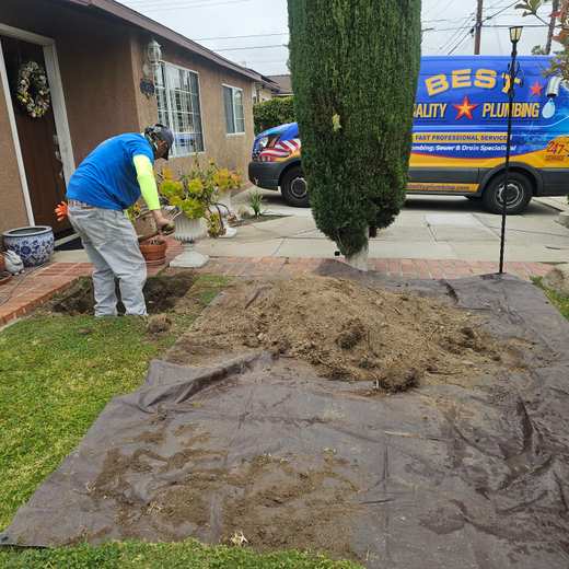 Best Quality Plumbing crew working on a sewer project outside a home