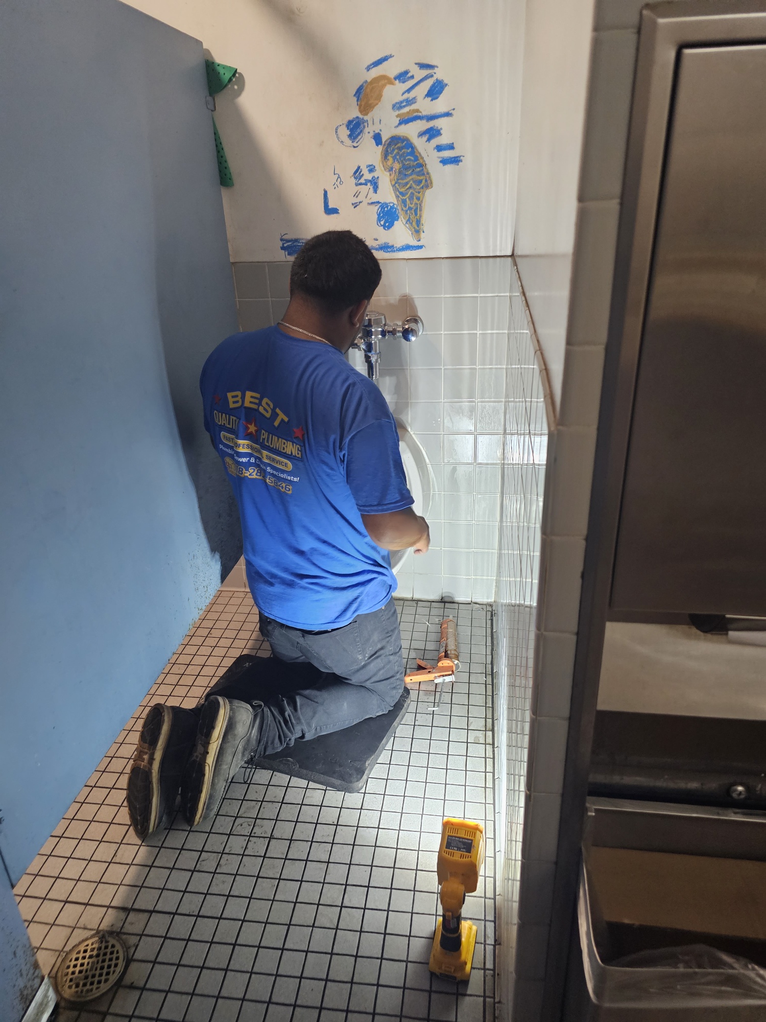Professional plumber working with precision tools